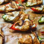 Vegan jalapeño poppers on baking tray.