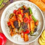 Overhead shot of a plant based stir fry in a white bowl.