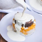 Whisky sauce without cream being poured over haggis, neeps, and tatties.