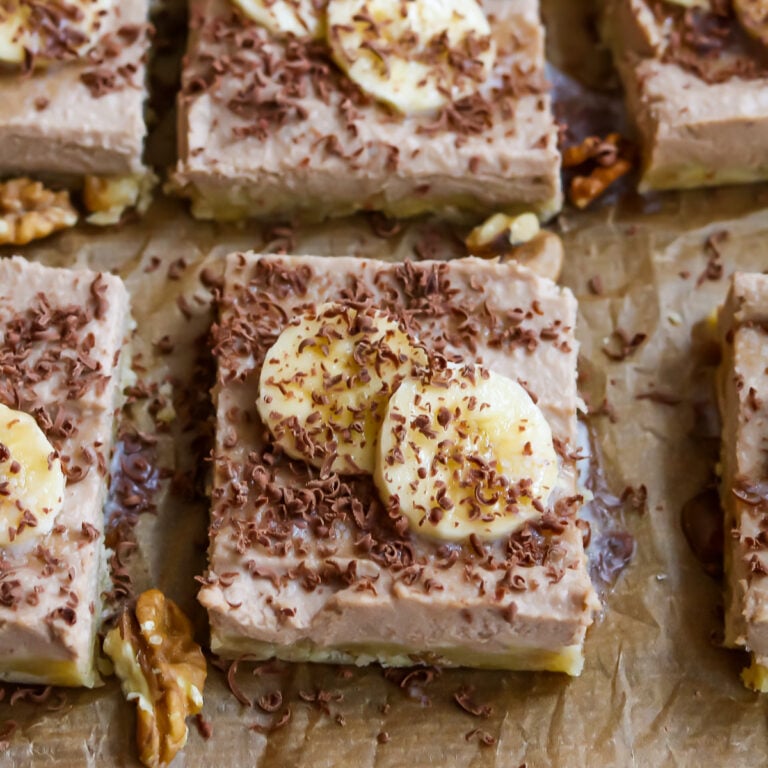 Raw Vegan Cheesecake slices on parchment paper.