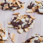 Coconut clusters on a wooden cutting board.