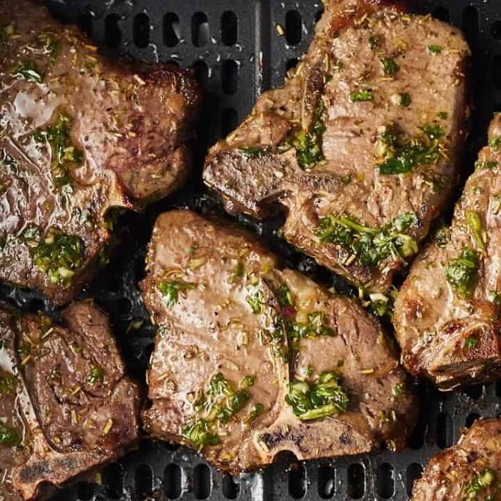 A group of meat on a grill.