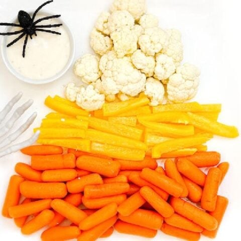 A plate with carrots and a fork on it.