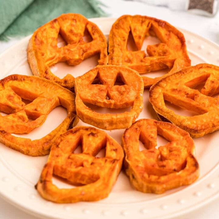 Pumpkin shaped waffles on a plate.