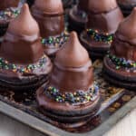 A tray of halloween chocolate witches hats.