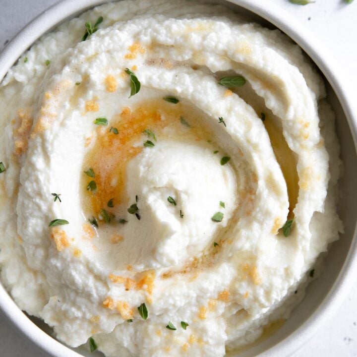 A keto-friendly bowl of mashed potatoes with chives, perfect for Christmas side dishes.
