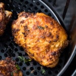 Leftover chicken thighs in an air fryer.