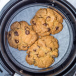 Overhead shot of air fryer cookies in an air fryer.
