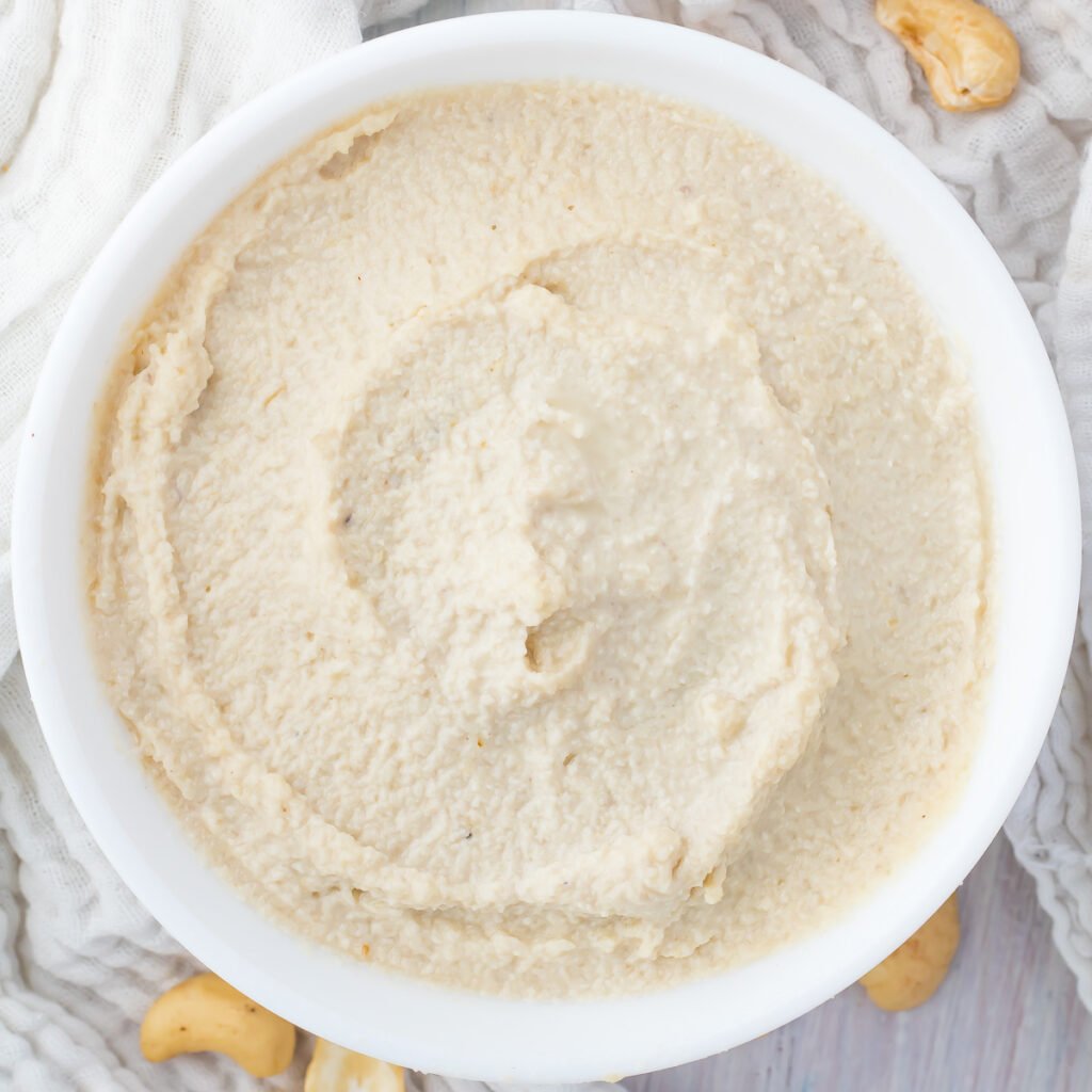 Overhead photo of whole30 cashew cream cheese in a white bowl.
