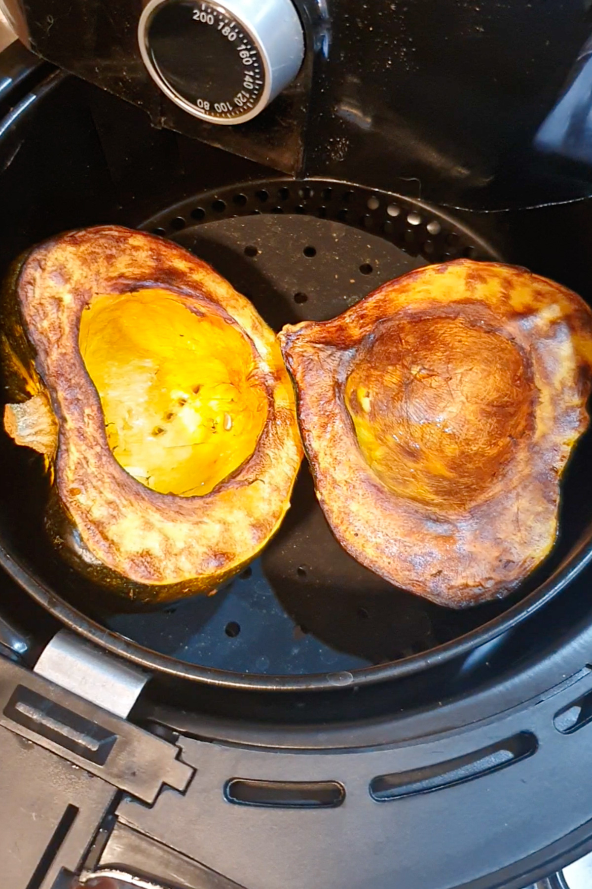 Roasted acorn squash in an air fryer.