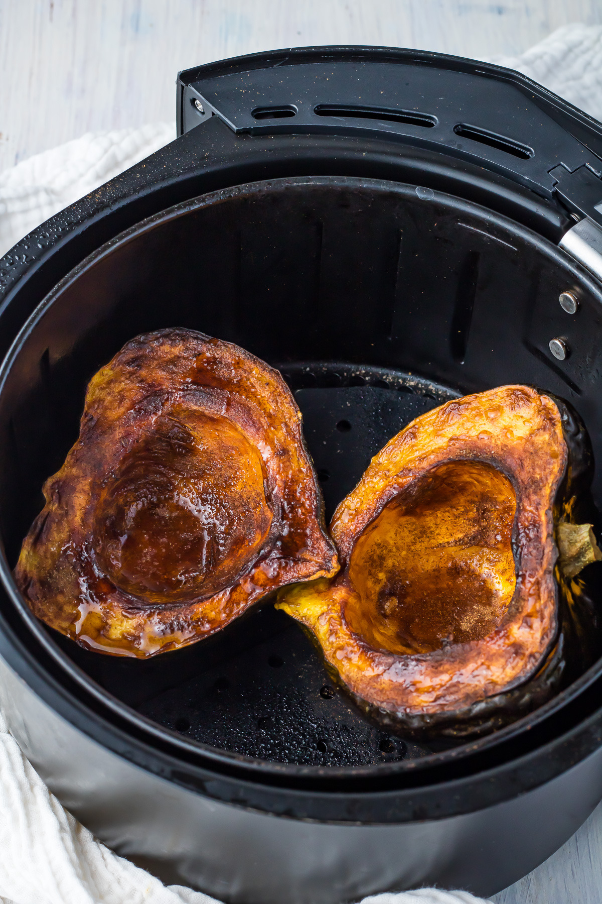 Roasted acorn squash in an air fryer.
