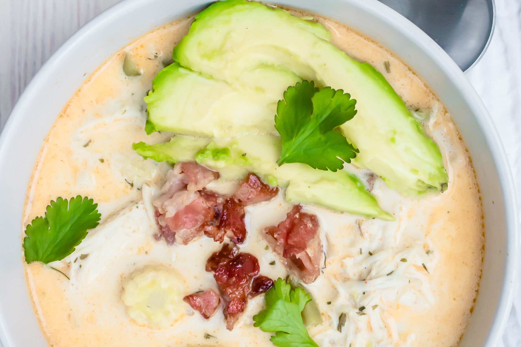 Overhead shot of keto white chicken chili in a grey bowl.