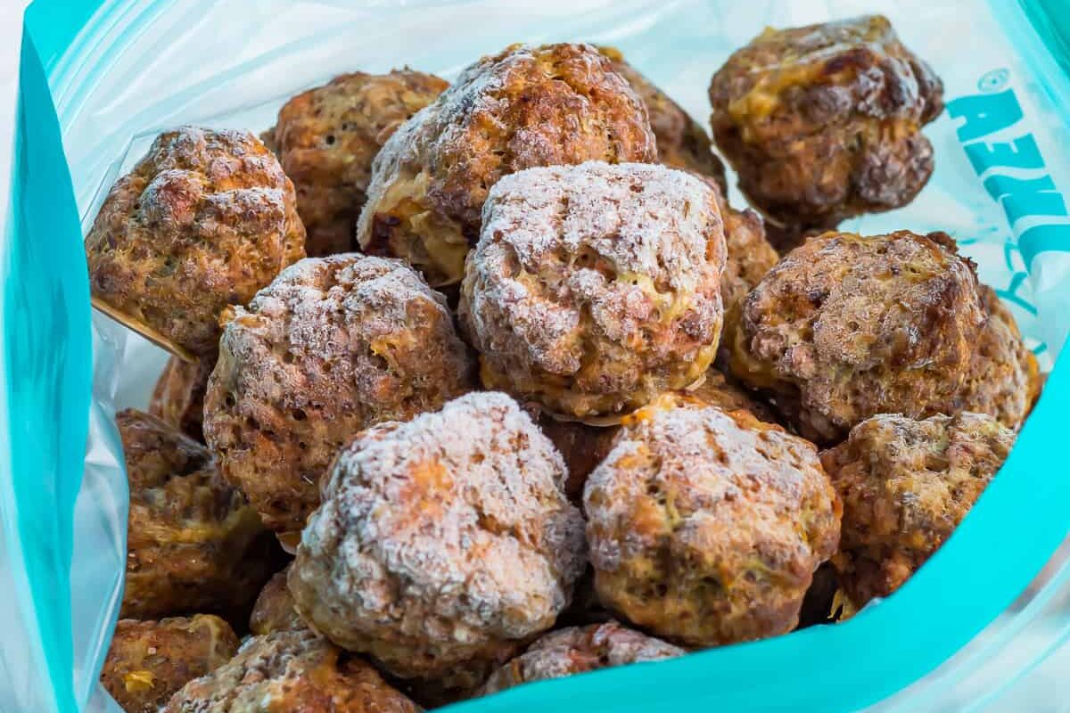 Frozen meatballs in a plastic bag on a table.