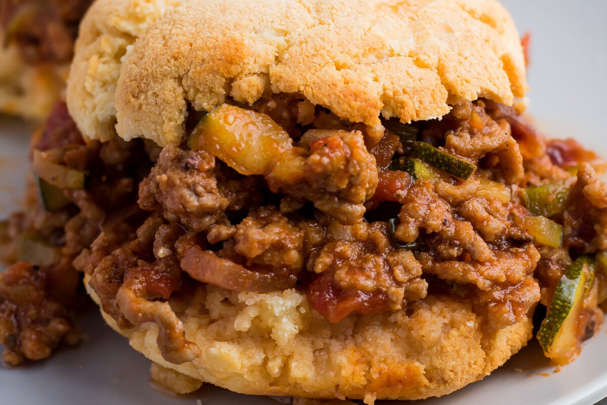 A plate with two sandwiches on it.