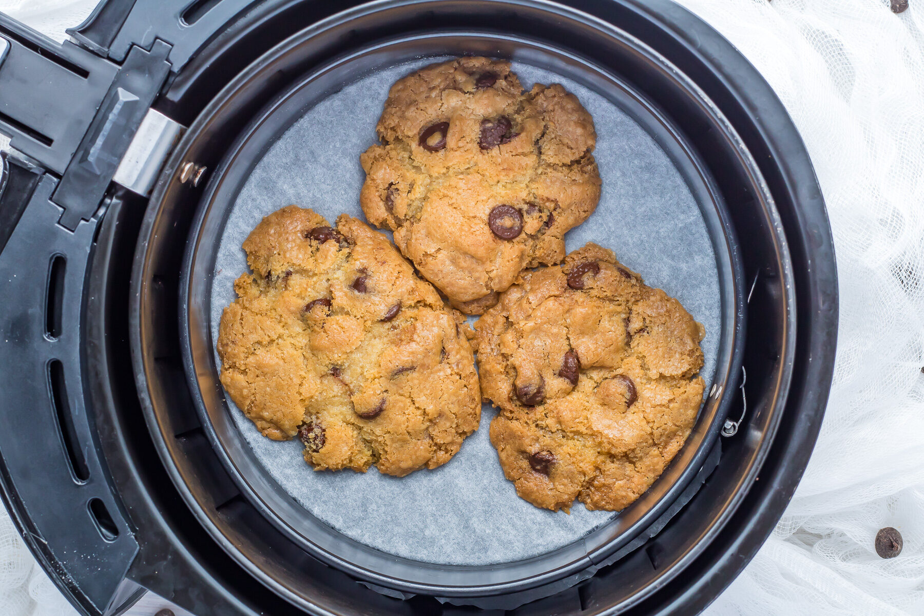 Overhead shot of air fryer cookies in an air fryer.
