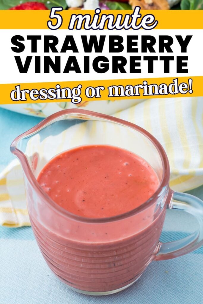 A clear glass filled with strawberry vinaigrette sits on a blue surface next to a yellow and white striped cloth. Text above describes this vibrant dressing or marinade as a 5-minute strawberry vinaigrette recipe.