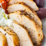 Sliced seasoned grilled chicken breast served with kalamata olives, cherry tomatoes, and a dollop of tzatziki sauce.