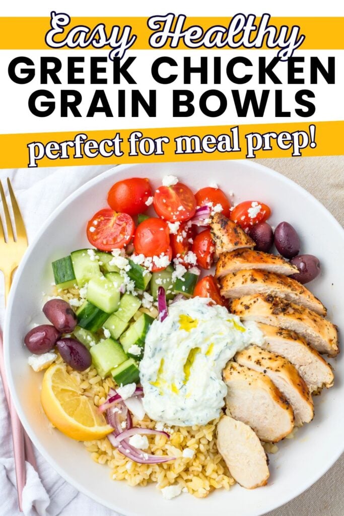 A bowl with sliced grilled chicken, brown rice, tzatziki, cucumber, tomatoes, olives, red onion, feta, and a lemon wedge is arranged neatly for a fresh and flavorful meal. “Greek Chicken Grain Bowls” text appears above, highlighting this wholesome Mediterranean-inspired dish.